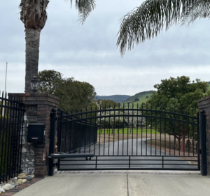 A metal driveway gate installed in a home.