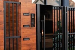 Automatic gate with metal fence in front of residential building