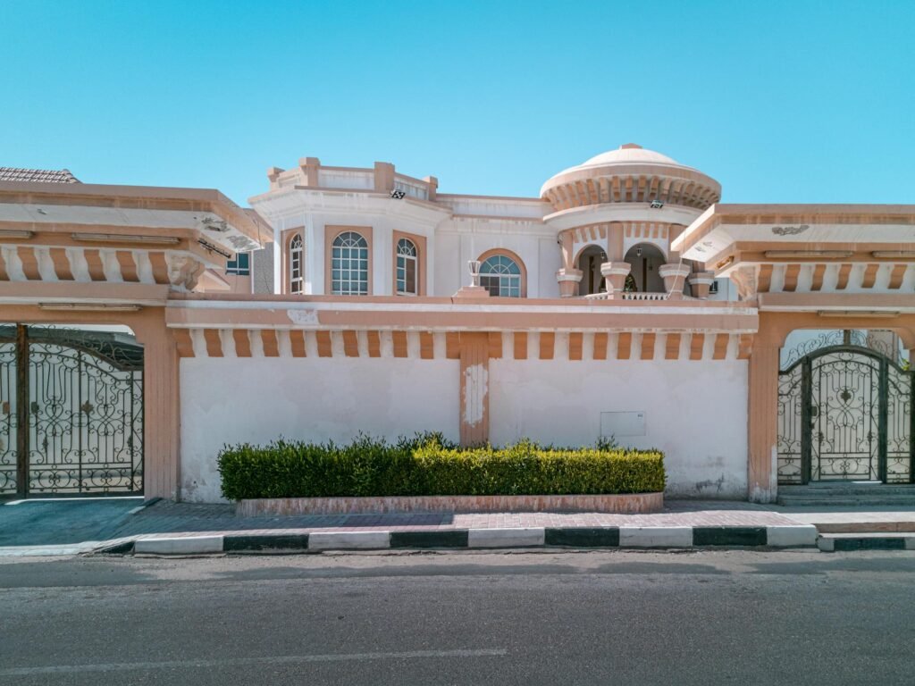 Ornate wrought iron gate with intricate details, blending security and elegance.